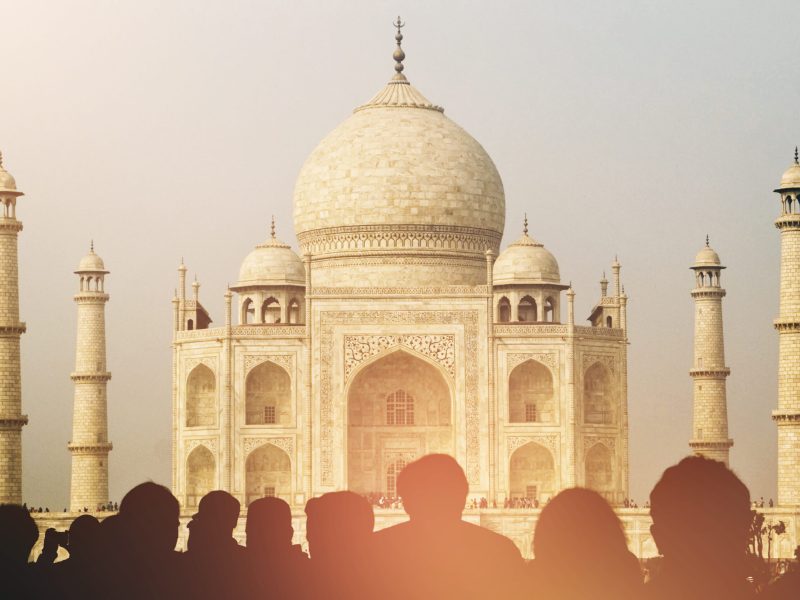 View of Taj Mahal with tourist silhouettes